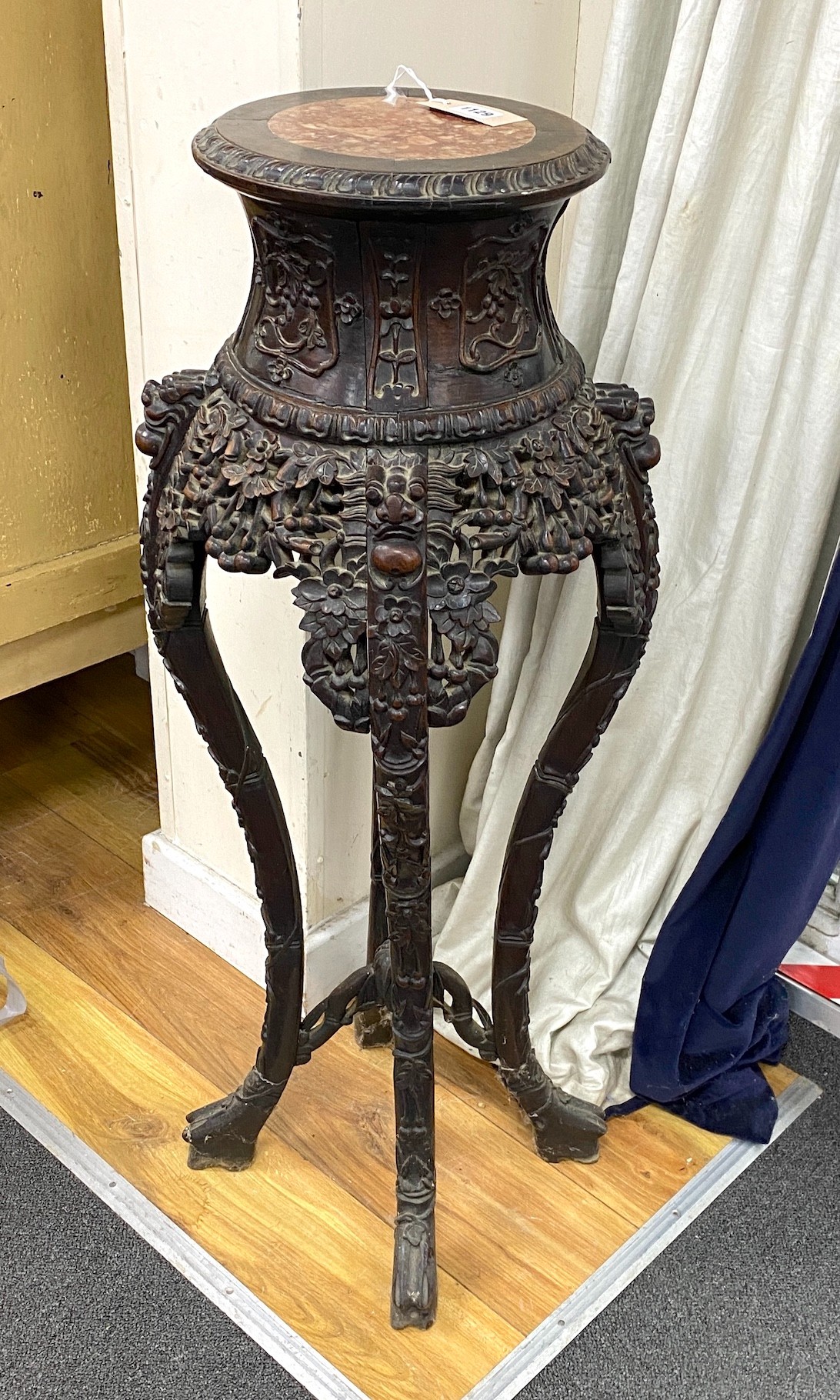 A Chinese carved hardwood marble topped vase stand, height 104cm